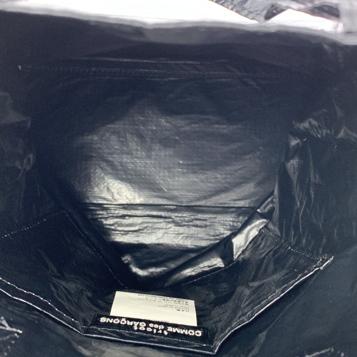 COMME des GARÇONS | 經編布料聚乙烯沖孔手提袋|