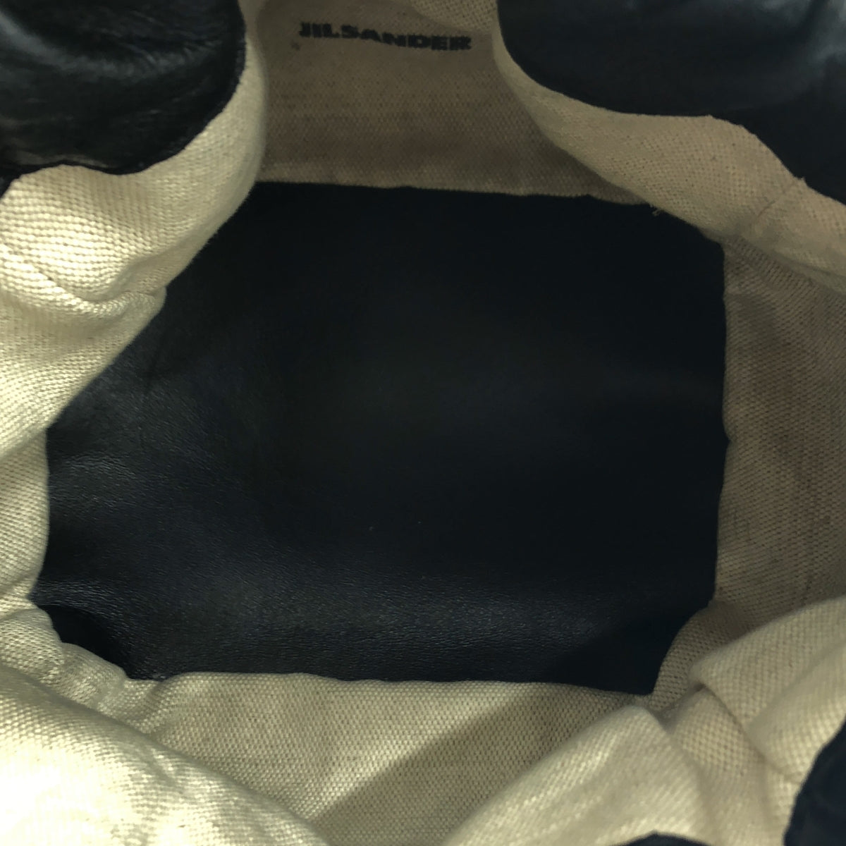 吉爾桑達 |可翻轉皮革抽繩斜背包 |黑色 |女性的