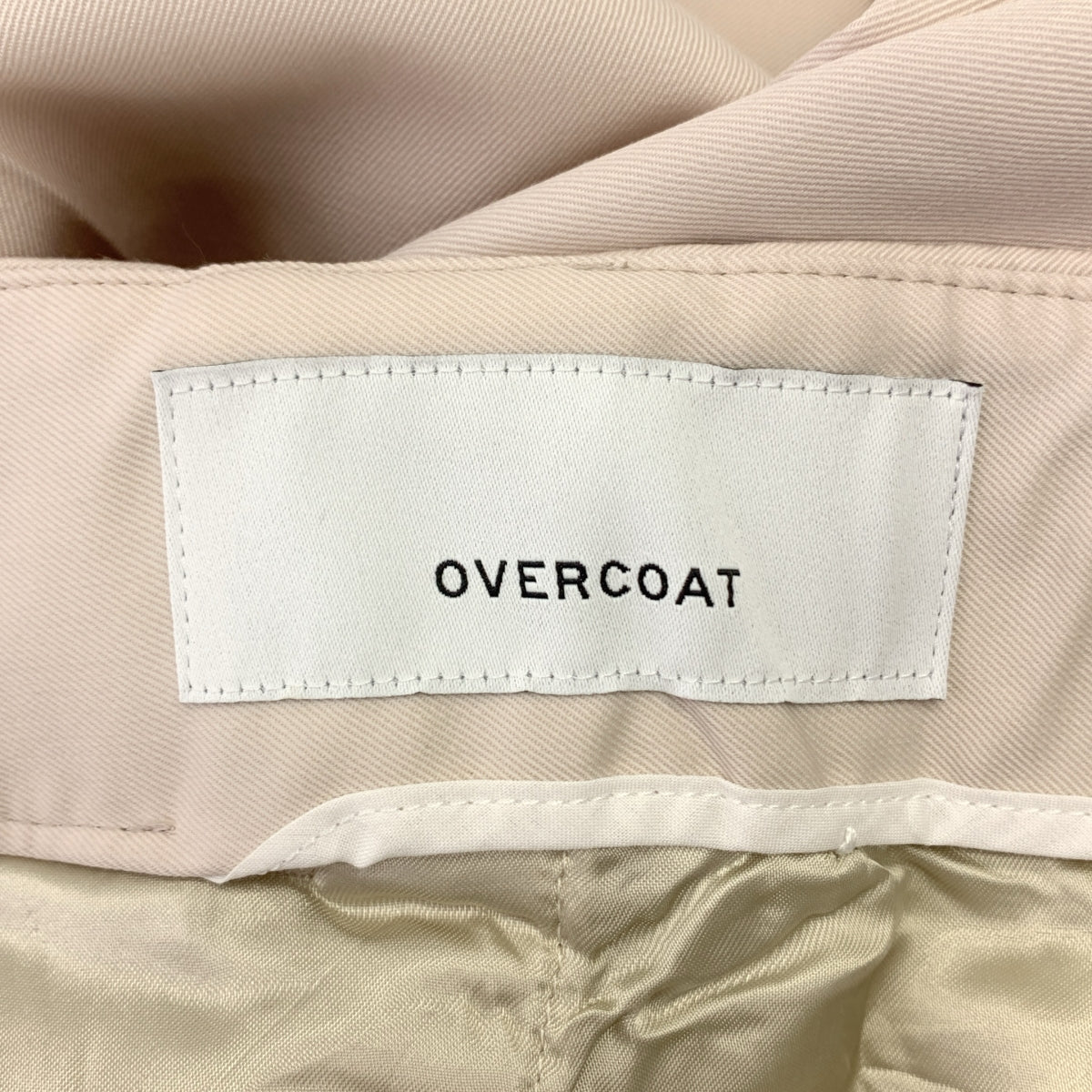 OVERCOAT / 오버코트 | 백 웨스트 고무 테이퍼드 슬랙스 팬츠 | 00 |