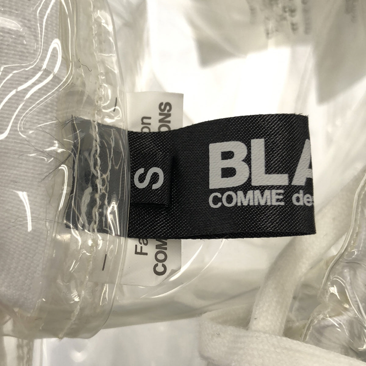 BLACK COMME des GARCONS / 블랙콤 데 갤슨 | 2022AW | slogan-print transparent skirt 롱 스커트 | S | 클리어/블랙 | 여성