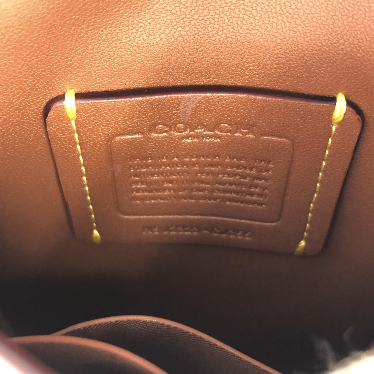 COACH | 小鹿斜背簽名帆布肩背包 |